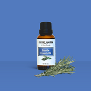 Essential oil bottle with a label on a blue background