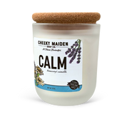 Candle with a label reading 'Calm' from Cheeky Maiden Soap Co. on a white background