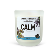 Candle with 'Cheeky Maiden Soap Co.' label on a white background