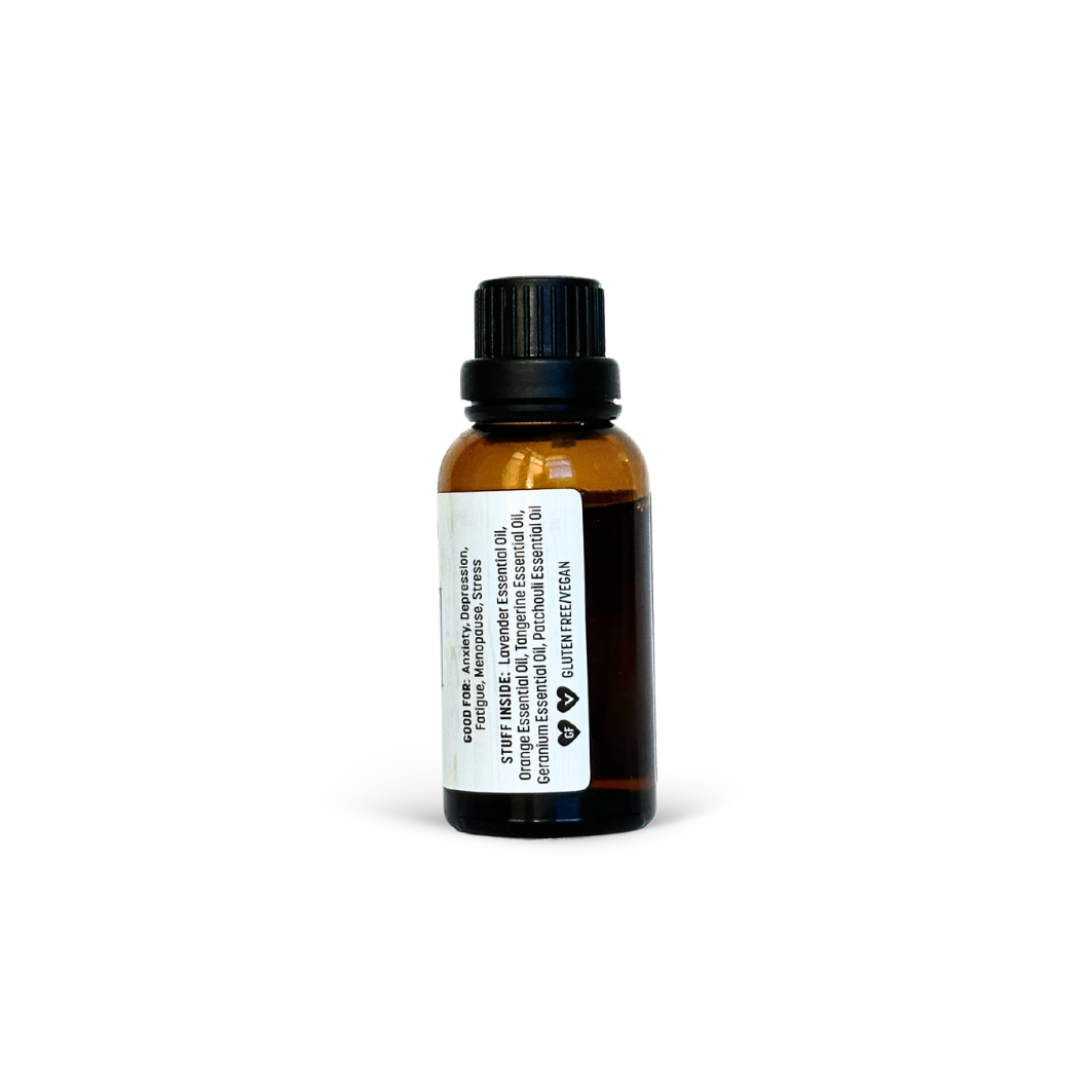 Small amber glass bottle with a black cap on a white background