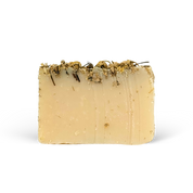 Bar of soap with natural ingredients on a white background
