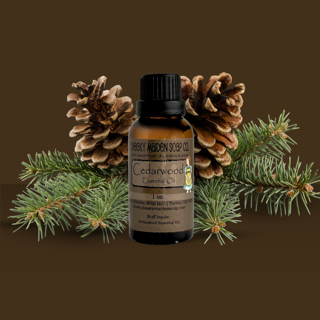 Bottle of Cedarwood essential oil with pine cones and branches on a brown background