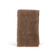 Rectangular bar of brown soap on a white background