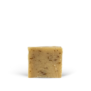 Bar of soap with visible texture on a white background
