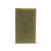 Green bar of soap on a white background