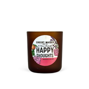 Candle with 'Happy Thoughts' label on a white background