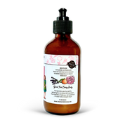 Amber glass bottle with a black pump on a white background