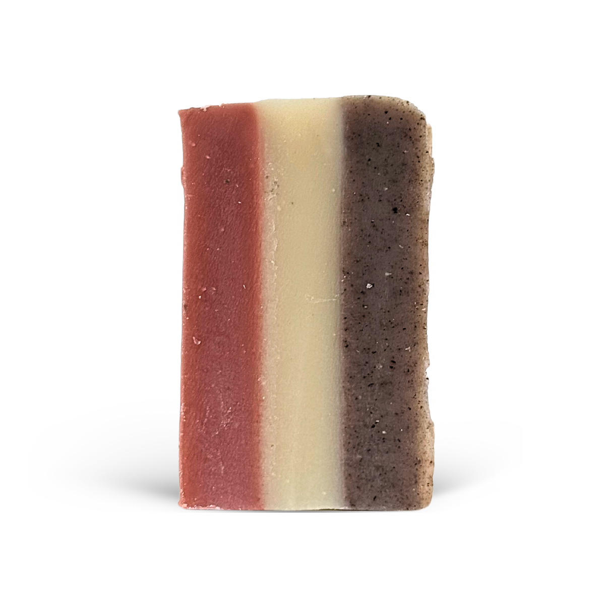 Three-layered soap bar with different textures and colors on a white background