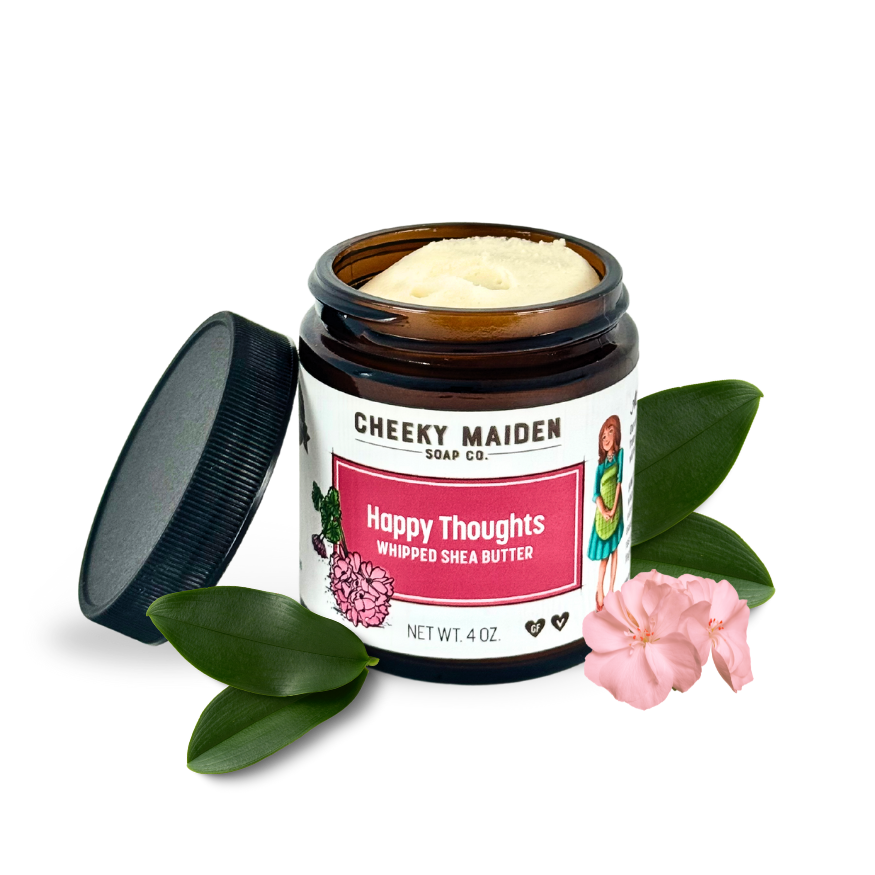 Jar of 'Happy Thoughts' whipped shea butter from Cheeky Maiden Soap Co. with a pink flower and green leaves on a white background.