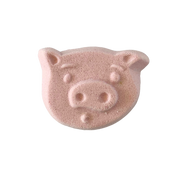 Pink pig-shaped bath bomb on a white background