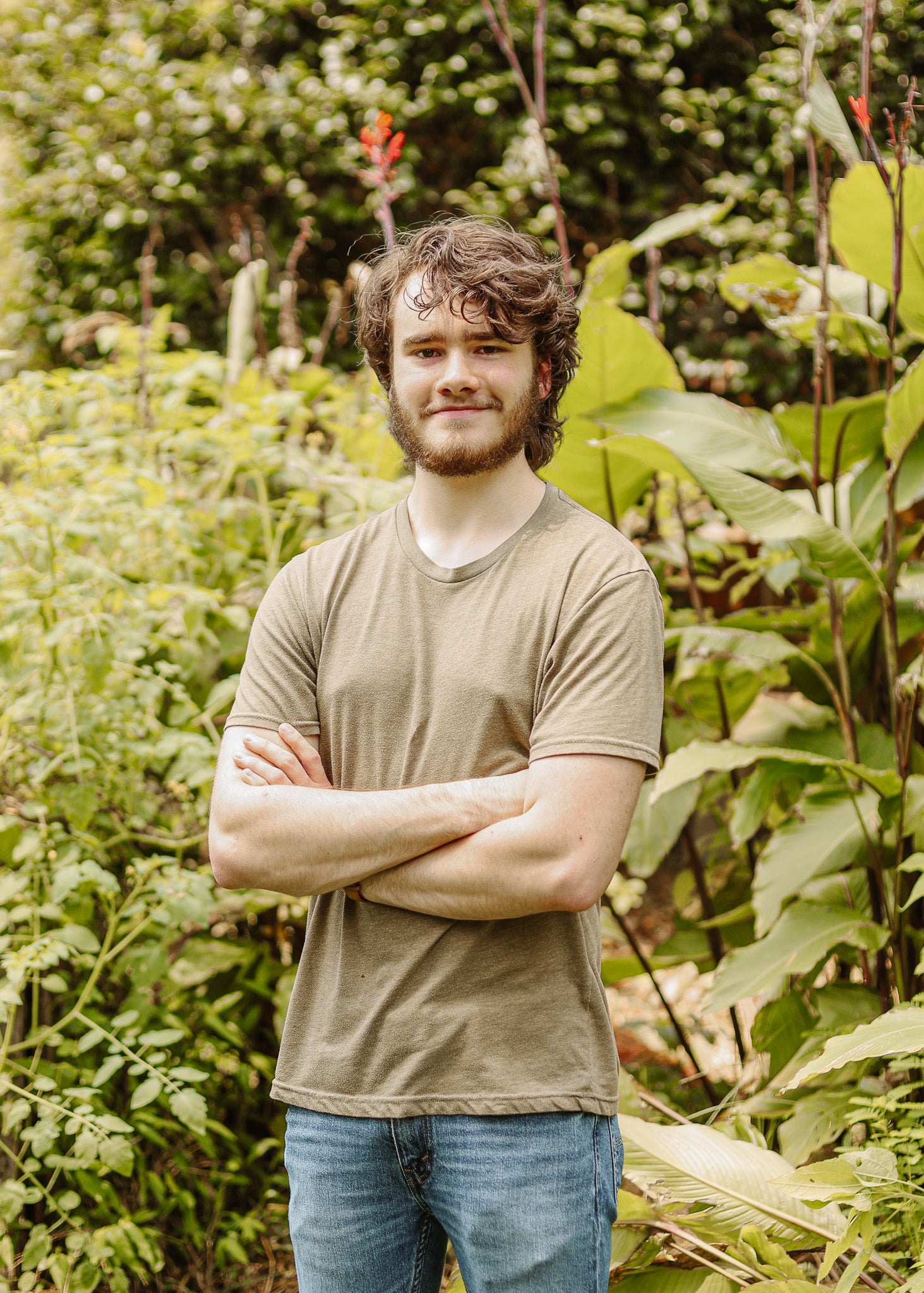 Nathan standing in a garden with greenery around