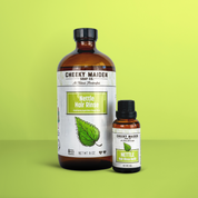 Two bottles of Cheeky Maiden Nettle Hair Rinse on a green background