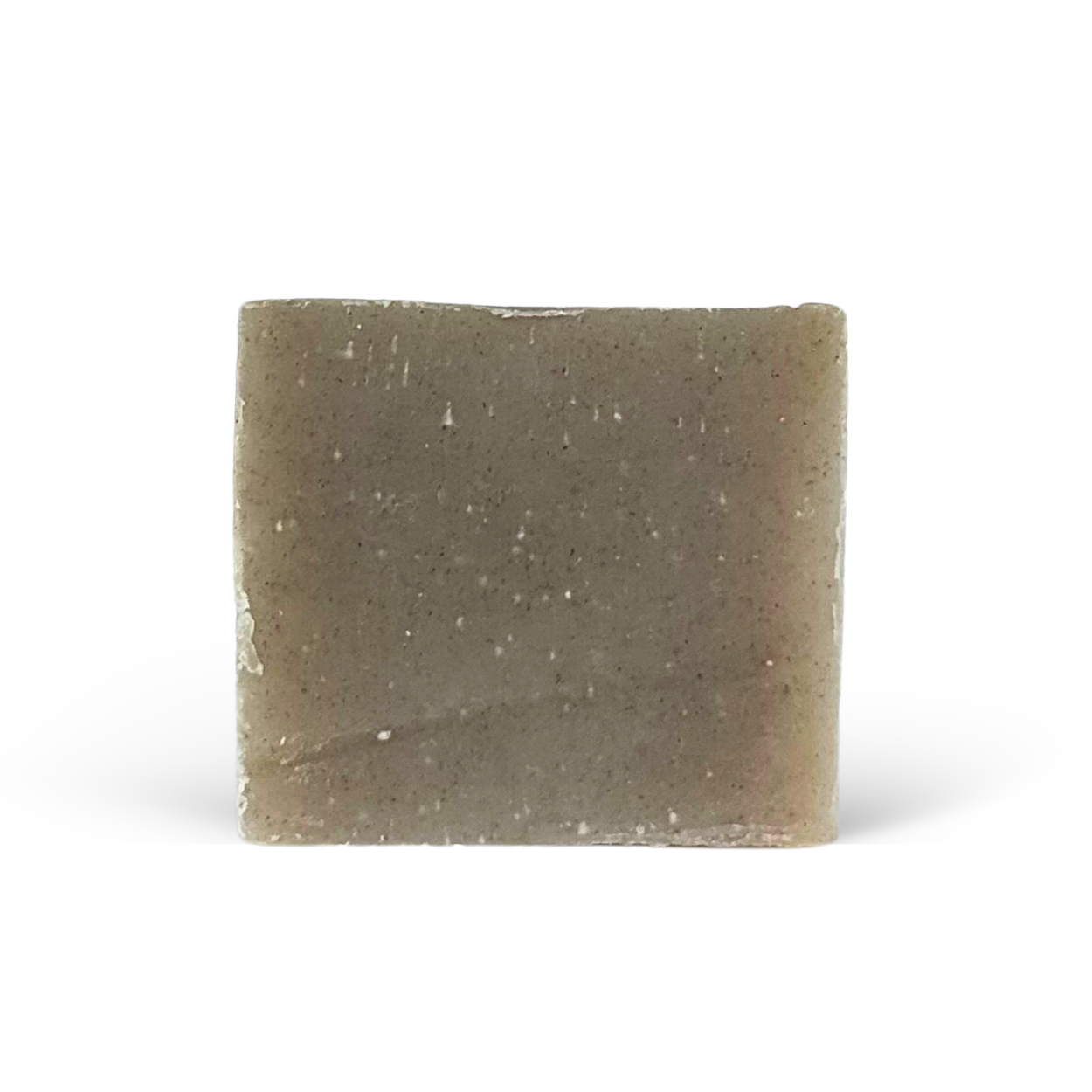 Square bar of soap with a speckled texture on a white background