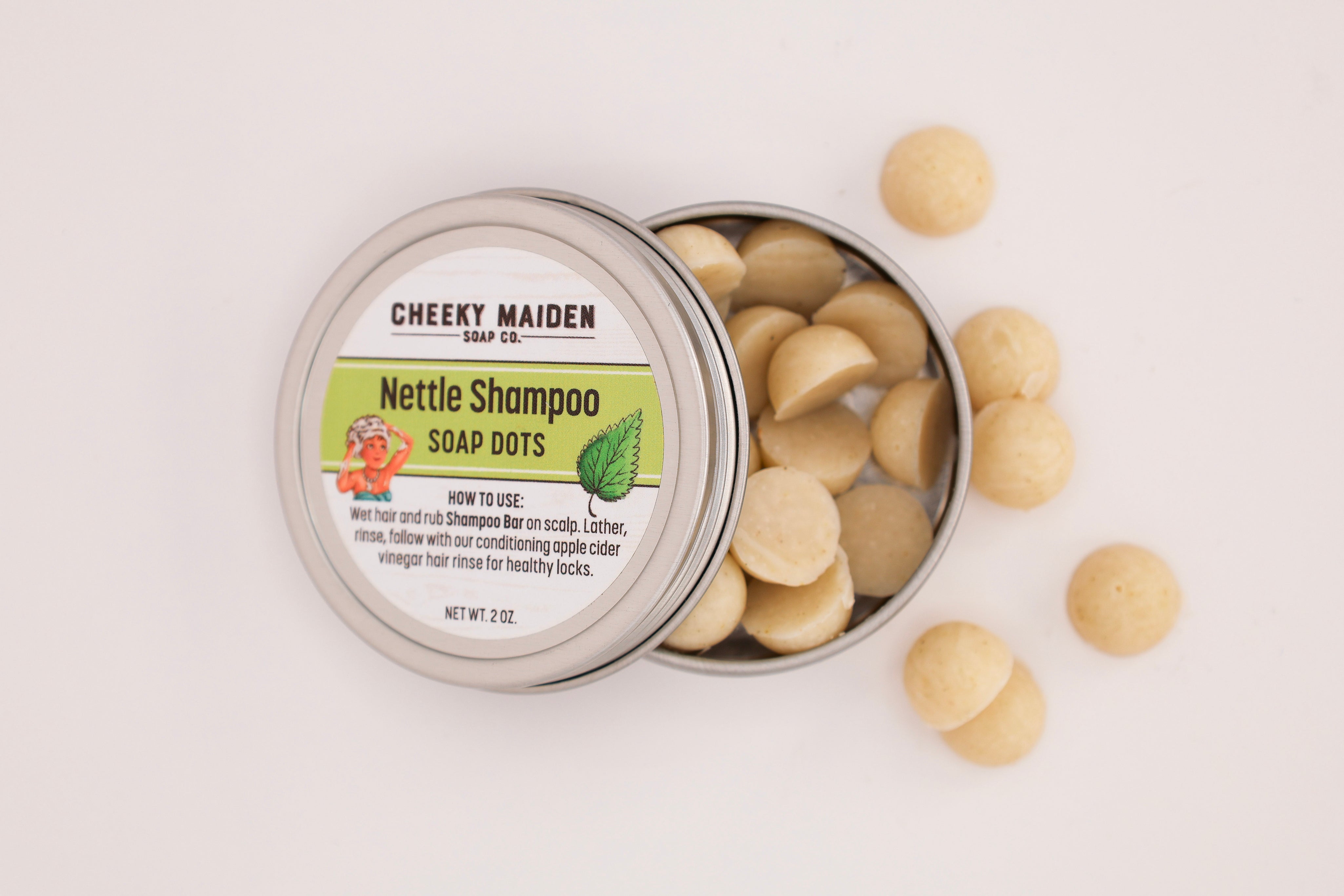 Tin of Cheeky Maiden Nettle Shampoo Soap Dots on a light background