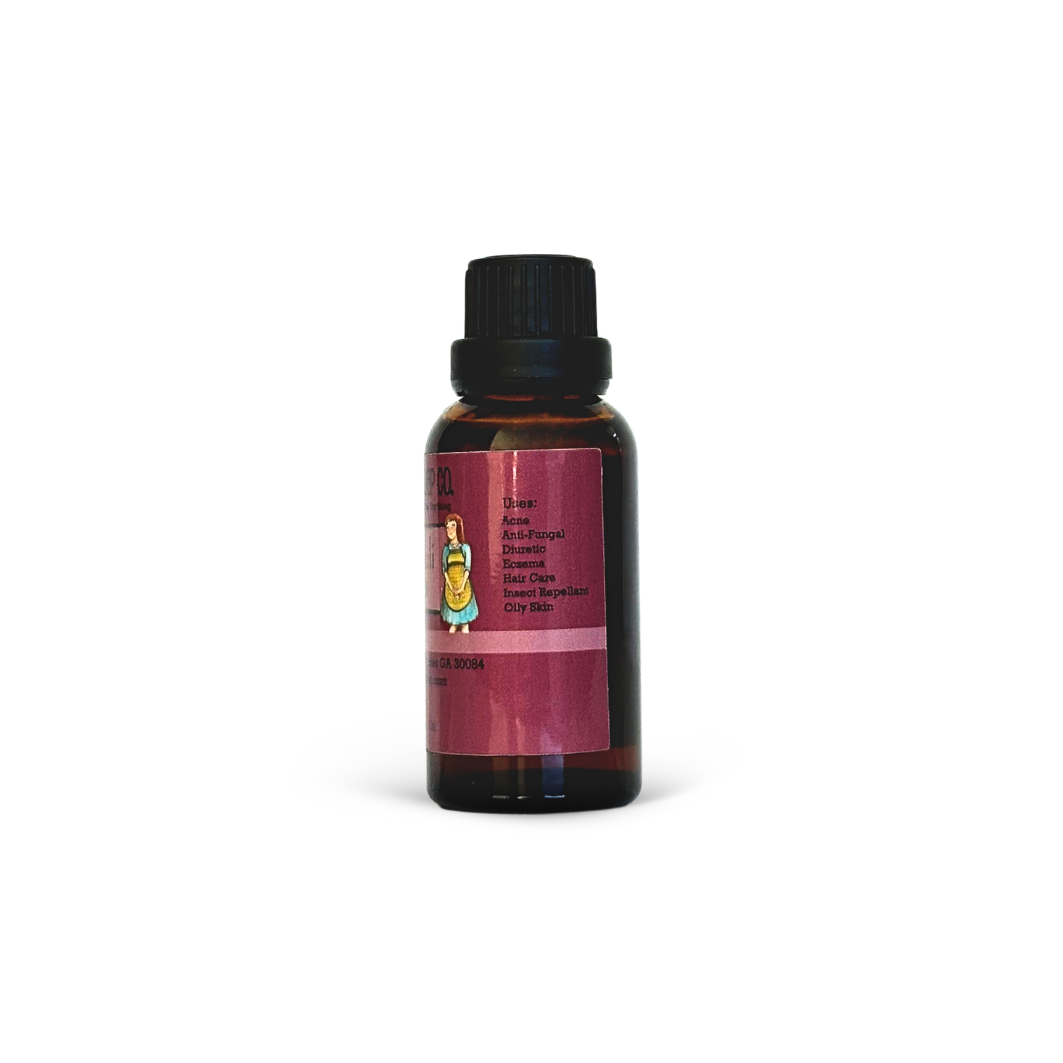 Bottle of oil with a label on a white background
