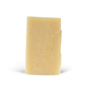 Beige bar of soap on a white background