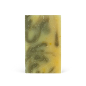 Bar of soap with green and yellow swirl pattern on a white background