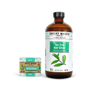 Cheeky Maiden Soap Co. Tea Tree Hair Rinse bottle and shampoo bar on a white background
