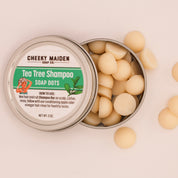 Cheeky Maiden Tea Tree Shampoo Soap Dots in a metal tin on a beige background