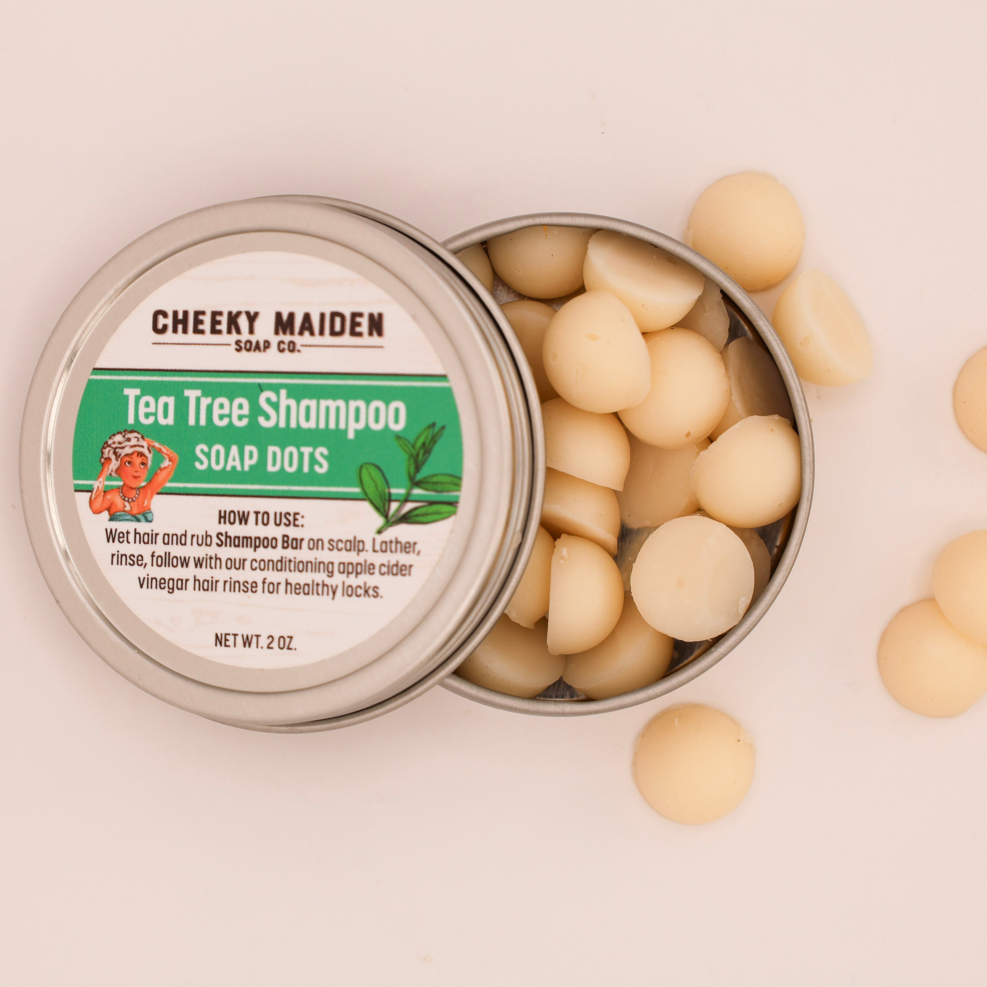 Cheeky Maiden Tea Tree Shampoo Soap Dots in a metal tin on a beige background